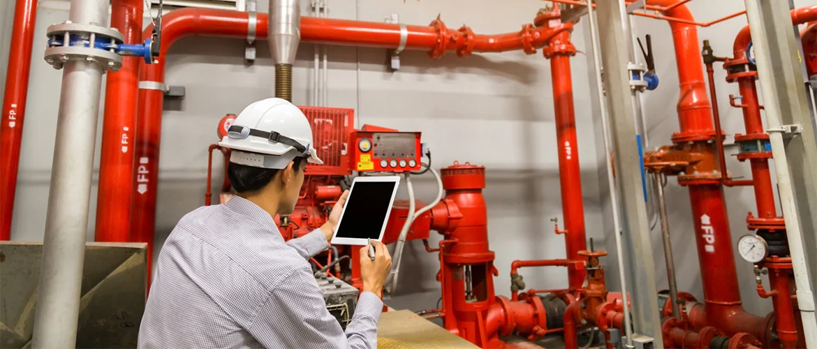 Fire safety engineer reviewing protection plans at a commercial building in Qatar